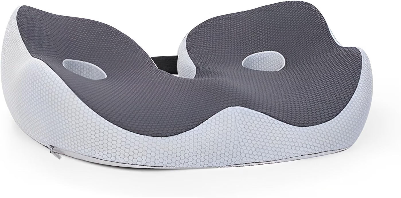 Angled top view of the gray-black butterfly-shaped memory foam seat cushion with a center cutout and ventilation holes