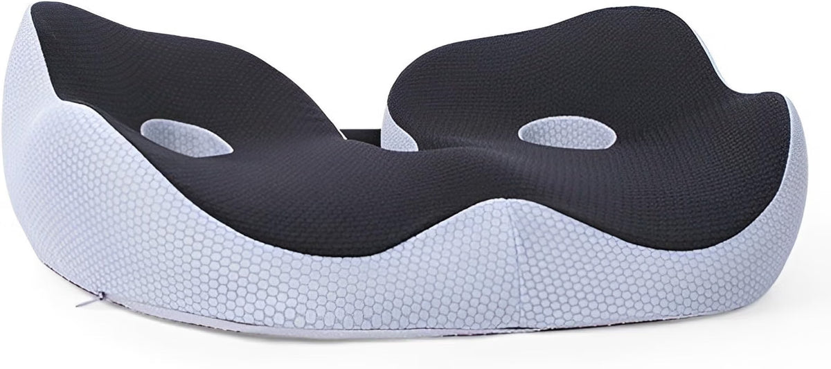 Front flat view of the black memory foam seat cushion showing its wave-shaped contour and dual hip grooves